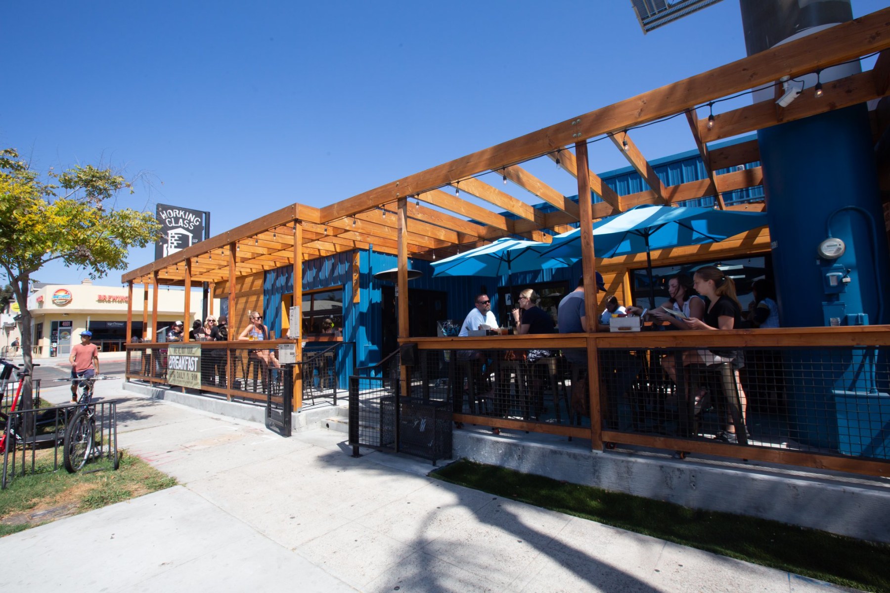 A scene from Working Class — diner counter, patio, booth